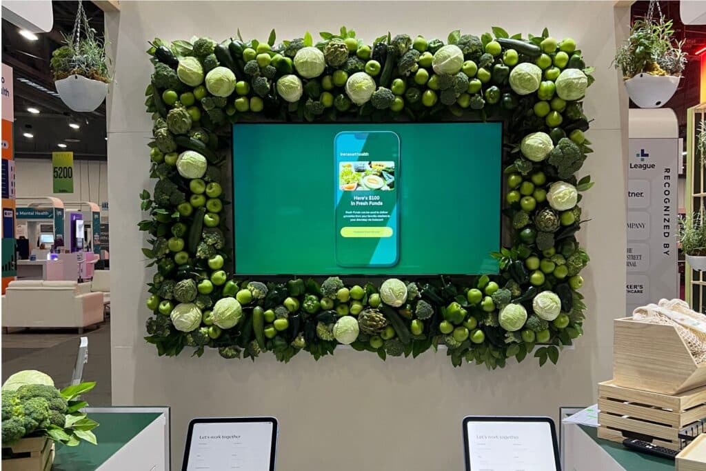 tv displayed framed by green plants